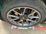 a close up of a tire on a car ' s rim