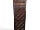an image of a tall wooden door with a pattern on it