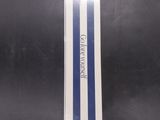 a close up of a black bag with a blue and white stripe on it