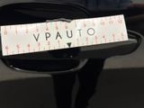 a sticker on the side mirror of a car that says v - auto