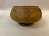 a small bowl that is sitting on a white surface