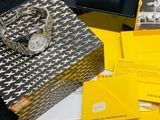 a box with a watch sitting on top of it