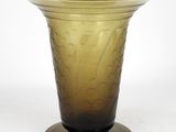 a glass vase that is sitting on a table