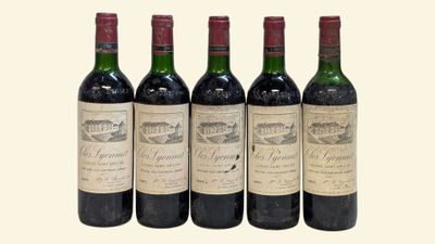 four bottles of wine are lined up in a row