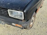 a black car that is parked on the side of the road
