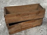 two wooden boxes that are sitting on the ground