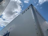 a large white truck with a blue star on the side of it