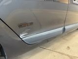 a close up of a car door with a sticker on it