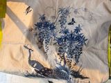 a bag that has a picture of a peacock on it