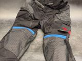 a pair of motorcycle pants laying on the floor