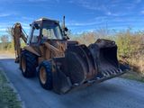 a tractor that is parked on the side of the road
