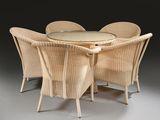 a table with four chairs around it and a glass top