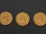 three gold sovereigns, one of which is a sovereign and one of which is a sovereign