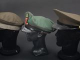 three hats are lined up on top of each other on a mannequin head