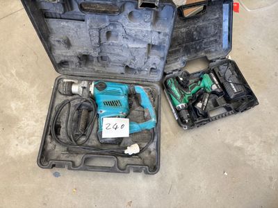 a tool case with tools in it sitting on the floor