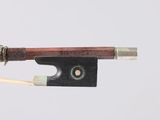 a close up of a violin bow on a white background