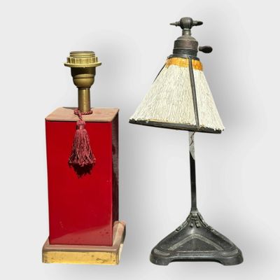 pair of antique lamps on stands with a red base and a white shade