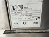 a label on the side of a stainless steel refrigerator