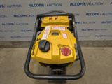 a yellow machine that is sitting on the ground