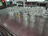 a lot of empty glasses on the table