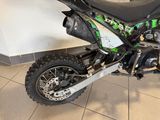a dirt bike that is parked in a showroom