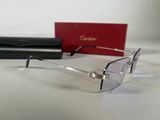glasses are laying on a white surface next to a red box