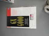 a book that is sitting on a table next to a mouse