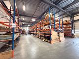 a large warehouse filled with lots of shelves and pallets