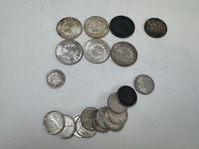 a smiley face made out of coins on a table