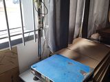 a scale sitting on a table in a room with boxes