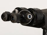 a close up view of a telescope with two lenses on it