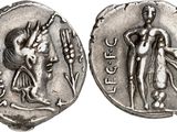 a silver coin with an image of a man and a woman on it
