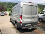 a silver van that is parked in a parking lot