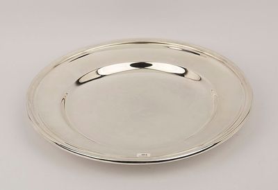 a silver plate on a white background with a silver handle