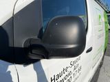a white van with a black side mirror on the side of it