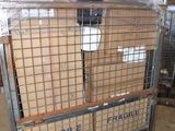 a metal cart with boxes on top of it in a warehouse