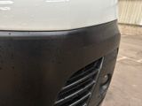 a close up of a car ' s front grill and hood