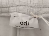 a close up of the label on the back of a white shirt