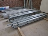several pieces of metal are stacked on top of each other in a room