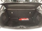 the trunk of a car with a red object in the trunk