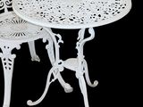 a white table and two chairs sitting next to each other