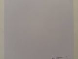 an image of a piece of paper with a sticker on it