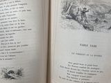 an open book with a picture of a man and a dog