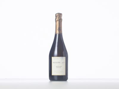 a bottle of wine that is sitting on a table