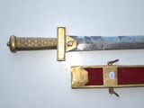 two different types of swords on a white surface
