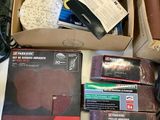 a box of sanding discs and other tools on a table
