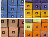 four different boxes of various flavored chocolates stacked on top of each other