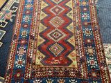 a large rug with many different colors and patterns on it