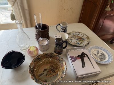 a table that has a bunch of plates and cups on it