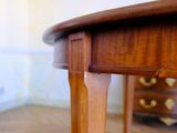 a wooden table with a drawer underneath it on a hard wood floor